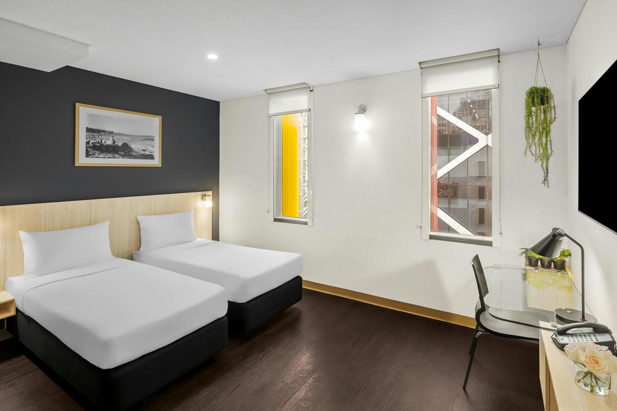 Superior Twin Room with City View, featuring ibis Sweet Beds and a 55-inch Smart TV with Chromecast