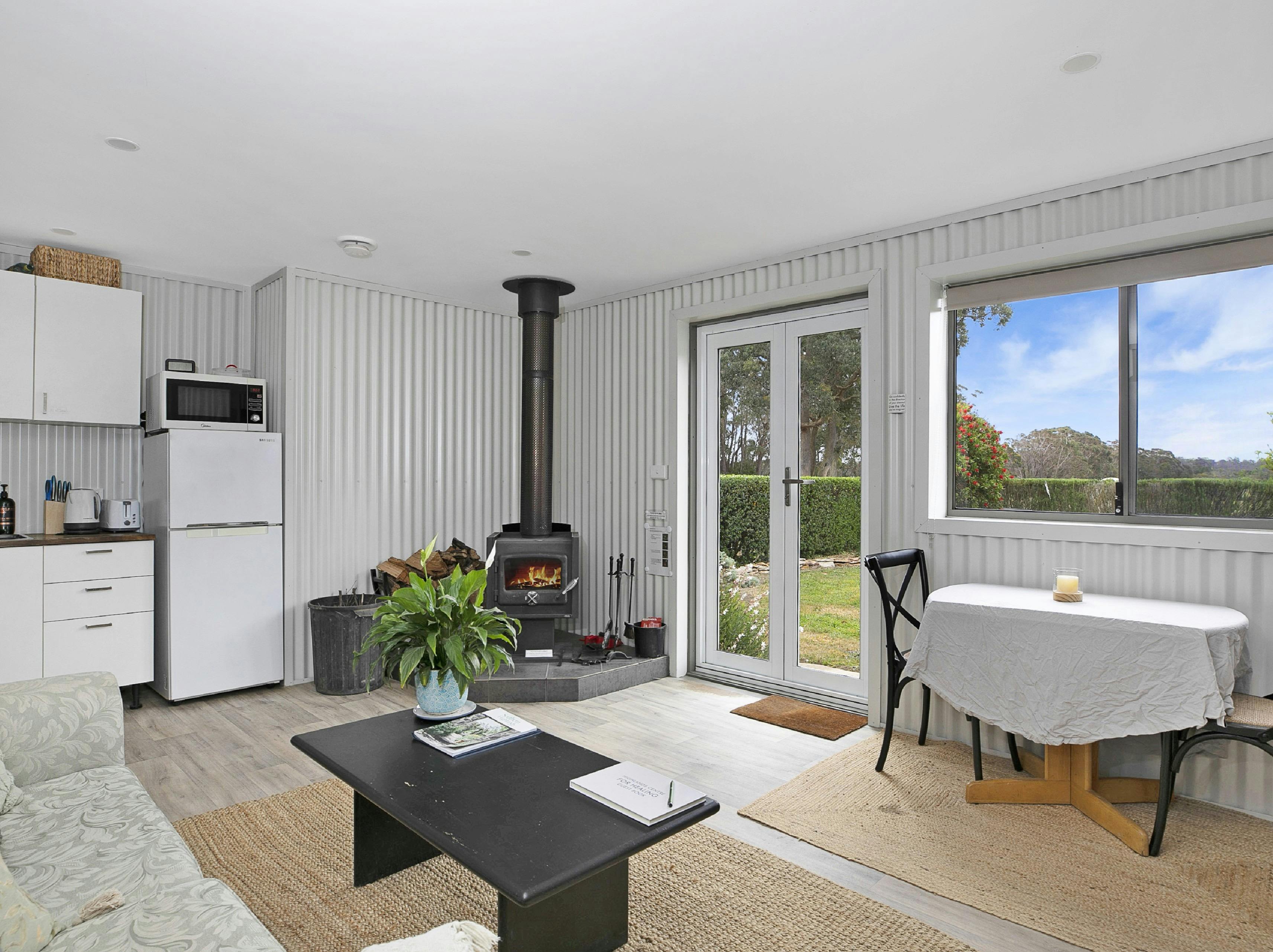 Living room at The Stables with woodfire
