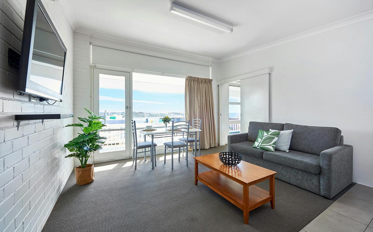 Apt 1,2,3 Ground Floor One Bedroom Apartment: featuring large balcony and separate Queen Bedroom