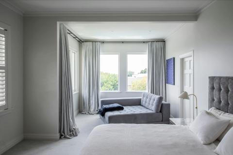 Large bedroom with double bed and cot bed