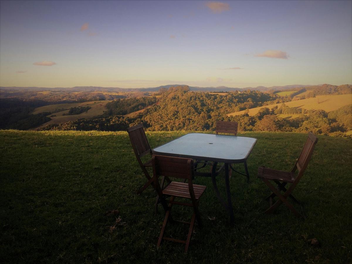 Outdoor setting with views over the valley nestled in a private garden
