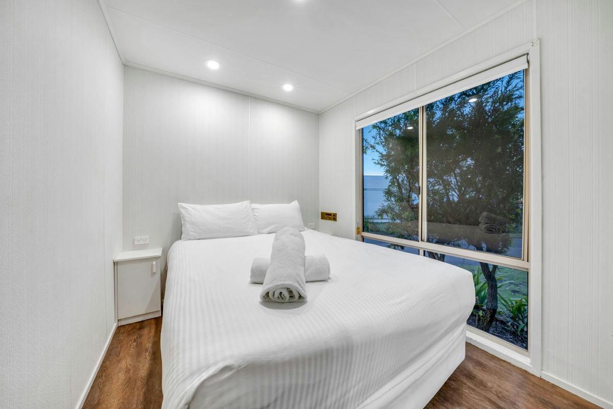 Budget Poolside Cabin Bedroom