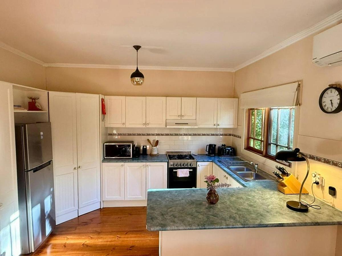 ChatGPT said:  Spacious open kitchen with gas stove  perfect for cooking, sharing meals, and sunset