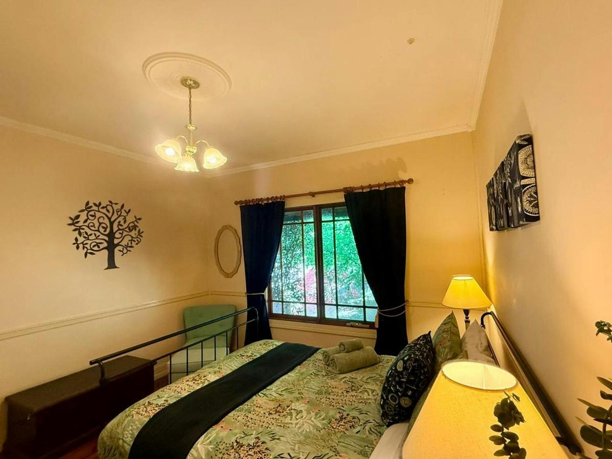 Cozy queen bed with lush green views and full privacy  your perfect spot to unwind and relax.