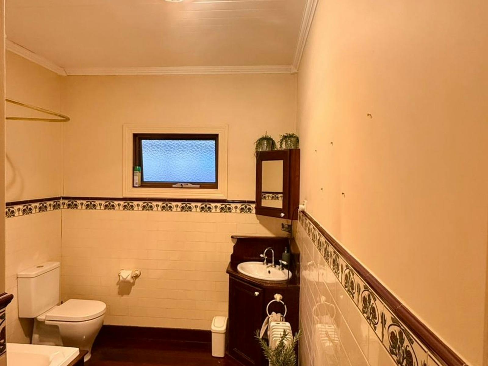 Spacious timber bathroom with a soothing tub perfect to unwind with a glass of wine after exploring