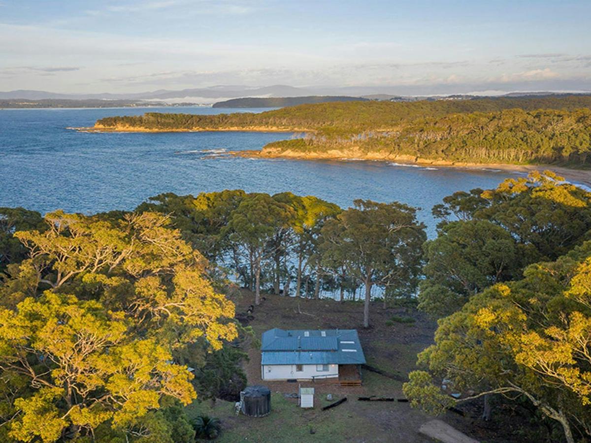 Aerial view of Judges House and the surrounding ocean and headlands. Photo: John Spencer &copy;DPIE
