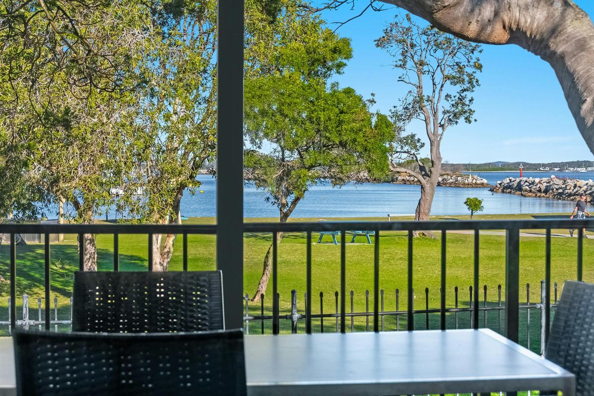 River view from the outdoor dining table on the waterfront cabin deck.
