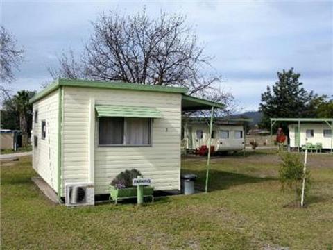 Cabins with ensuite bathroom, a/c, heating, kitchen, lounge, dining area, and TV