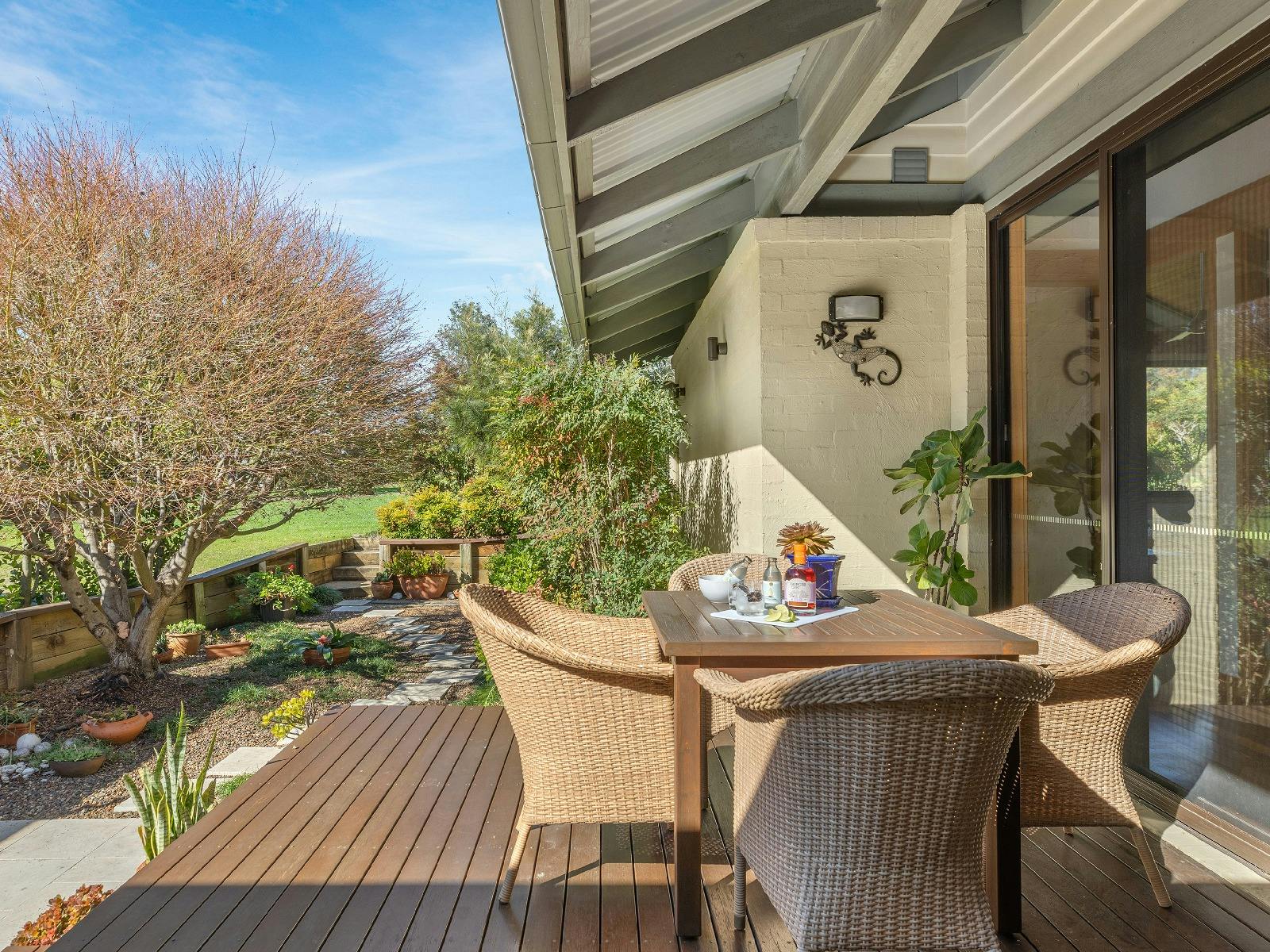 Maple Manor backyard with Japanese Maple Tree and access to the parkland behind