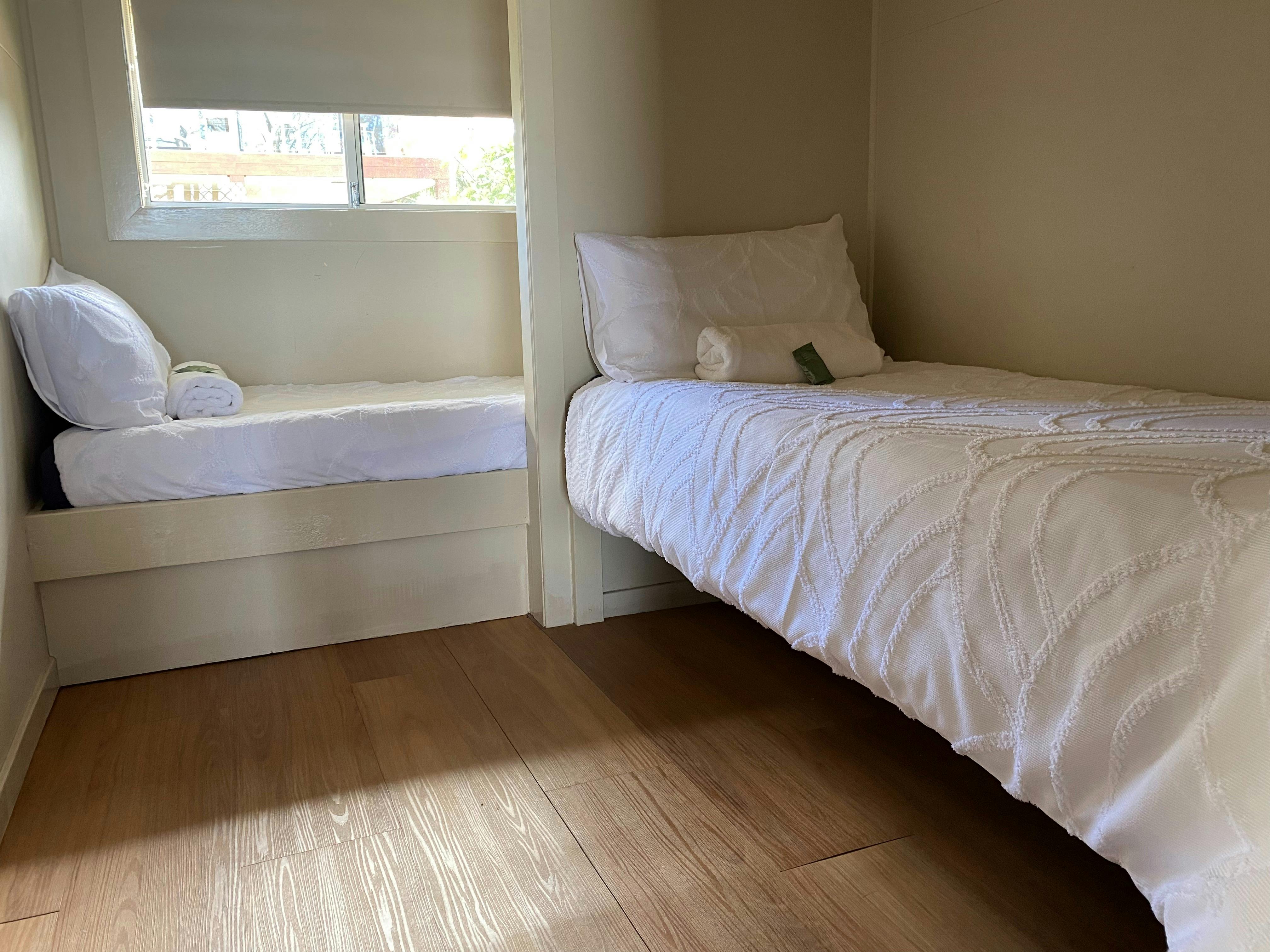 2nd bedroom has 2 single beds, slightly narrower than normal single so more suited to children.