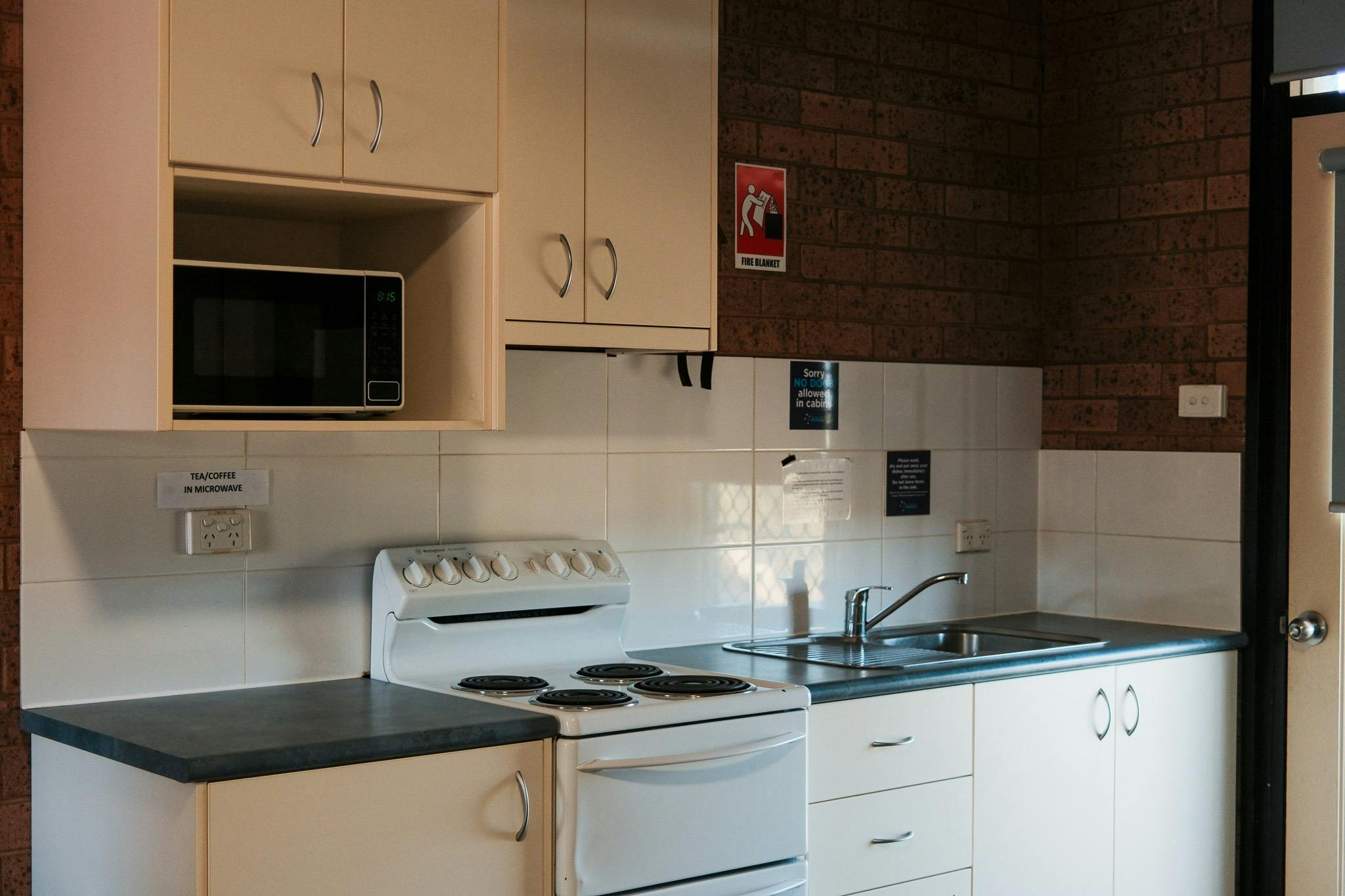 Kitchen facilities inside a cabin at Lake Talbot Tourist Park Narrandera