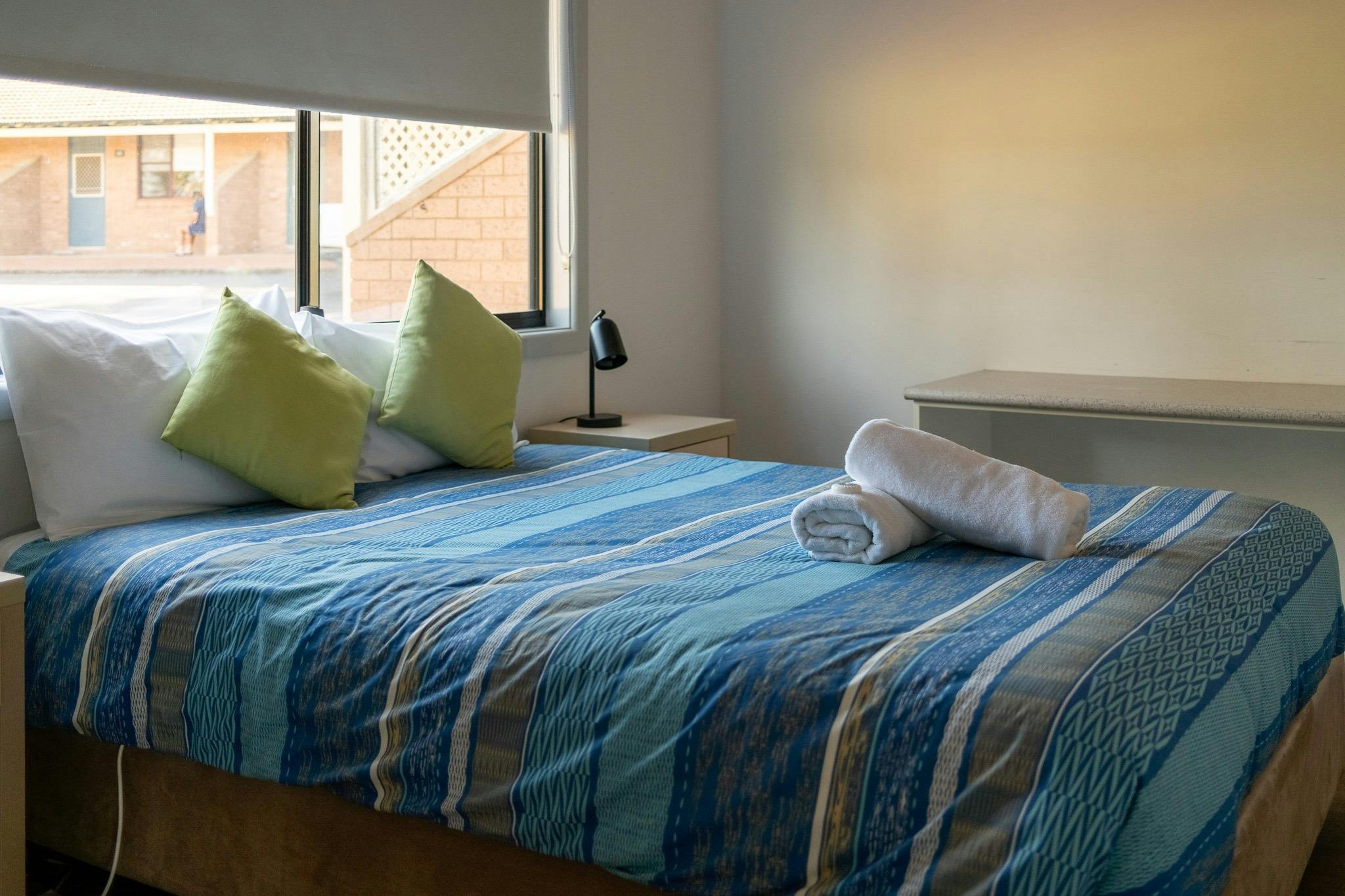 Bedroom inside a cabin at Lake Talbot Tourist Park Narrandera