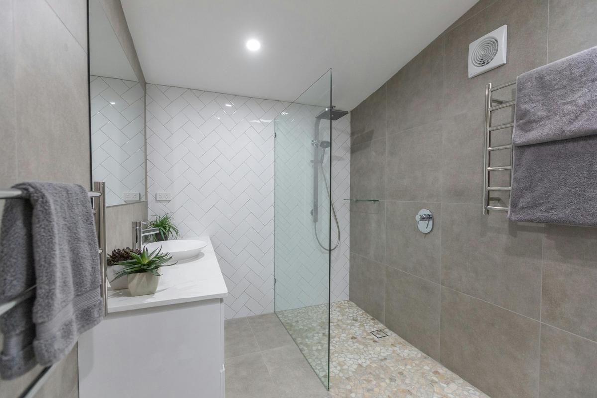 Large bathroom allowing for wheelchair or shower seat