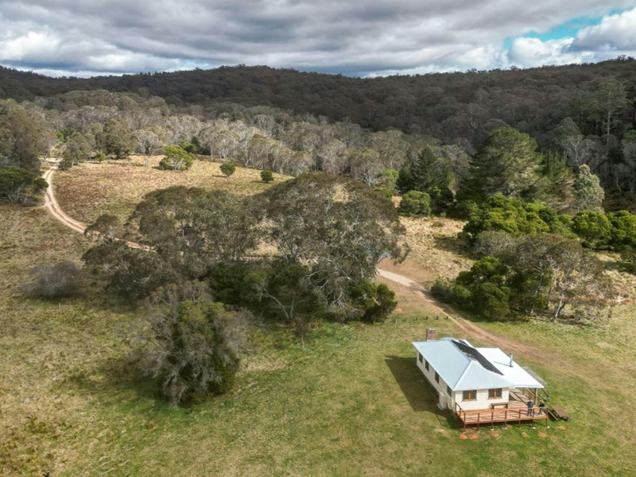 An aerial shot of Mooraback Cabin surrounded by World Heritage-listed Gondwana rainforest in