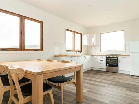 The dining table and kitchen in Mooraback Cabin, Werrikimbe National Park. Photo: David Waugh &copy;