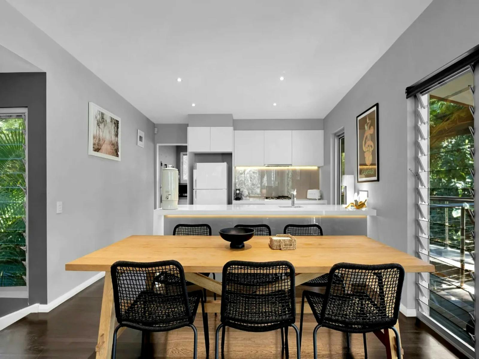 Open-plan dining and kitchen area with modern design and seamless flow