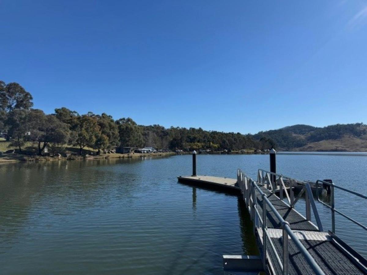 The Lake Lyell pontoon with vies of the Skil Lodge Cabin and waterfront campsites