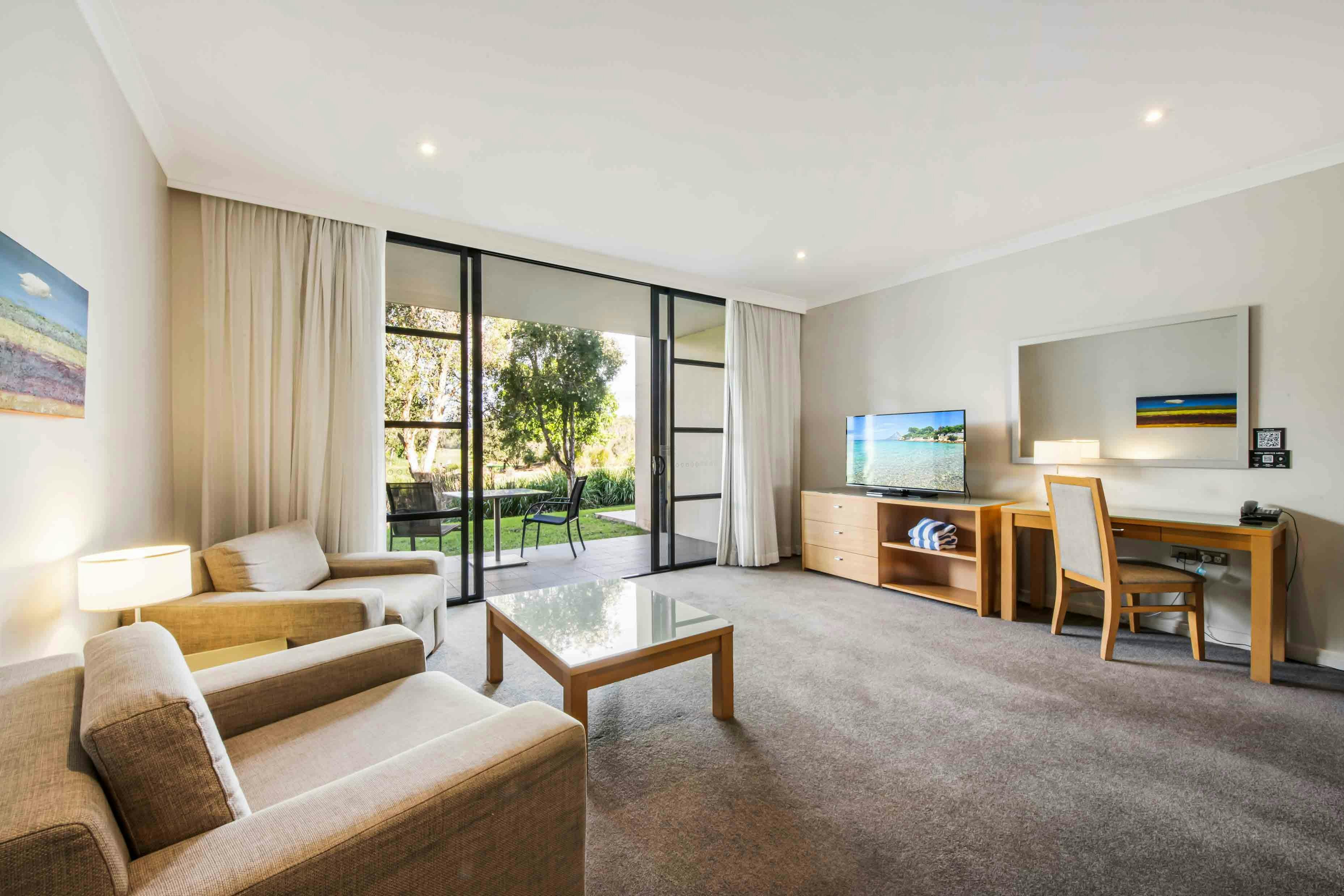 apartment living area at mercure kooindah waters hotel room