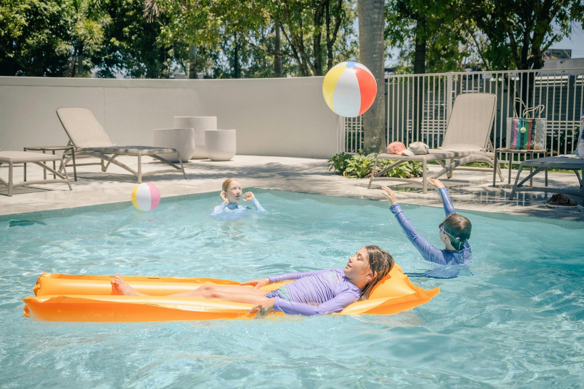 Children having fun in the pool