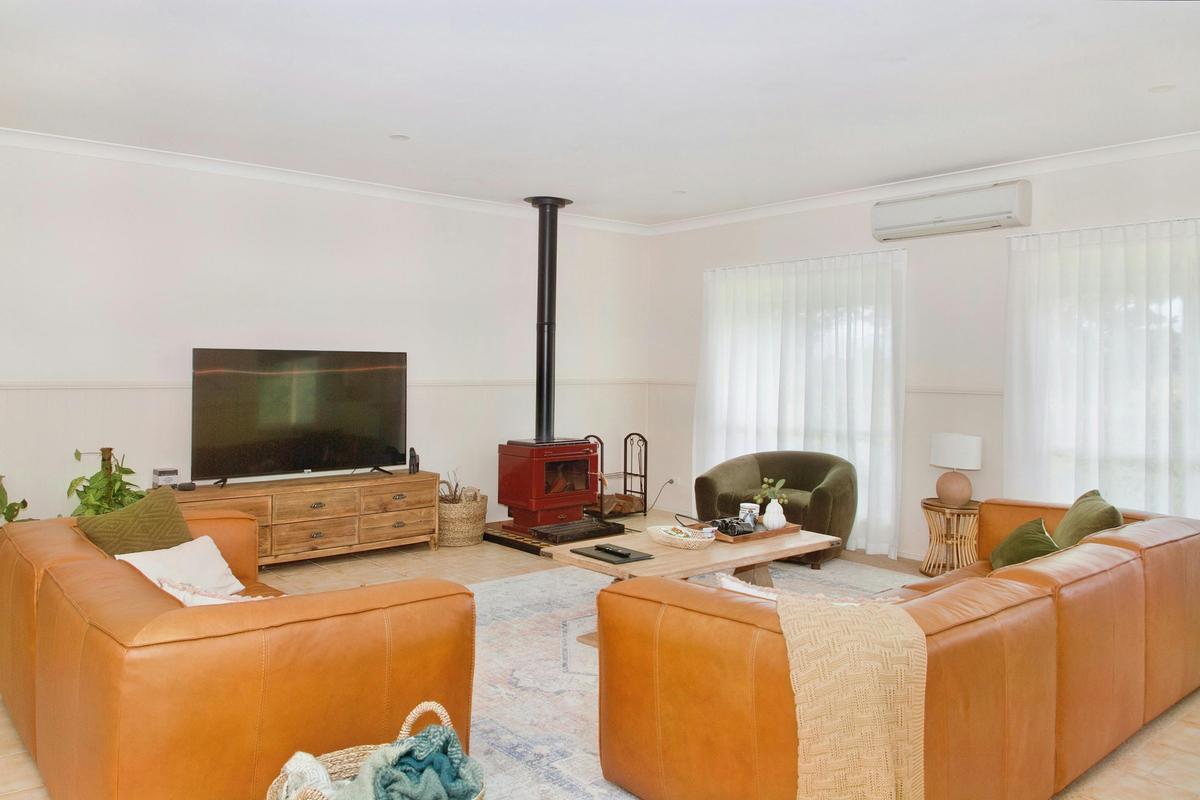 Living room with TV and fireplace