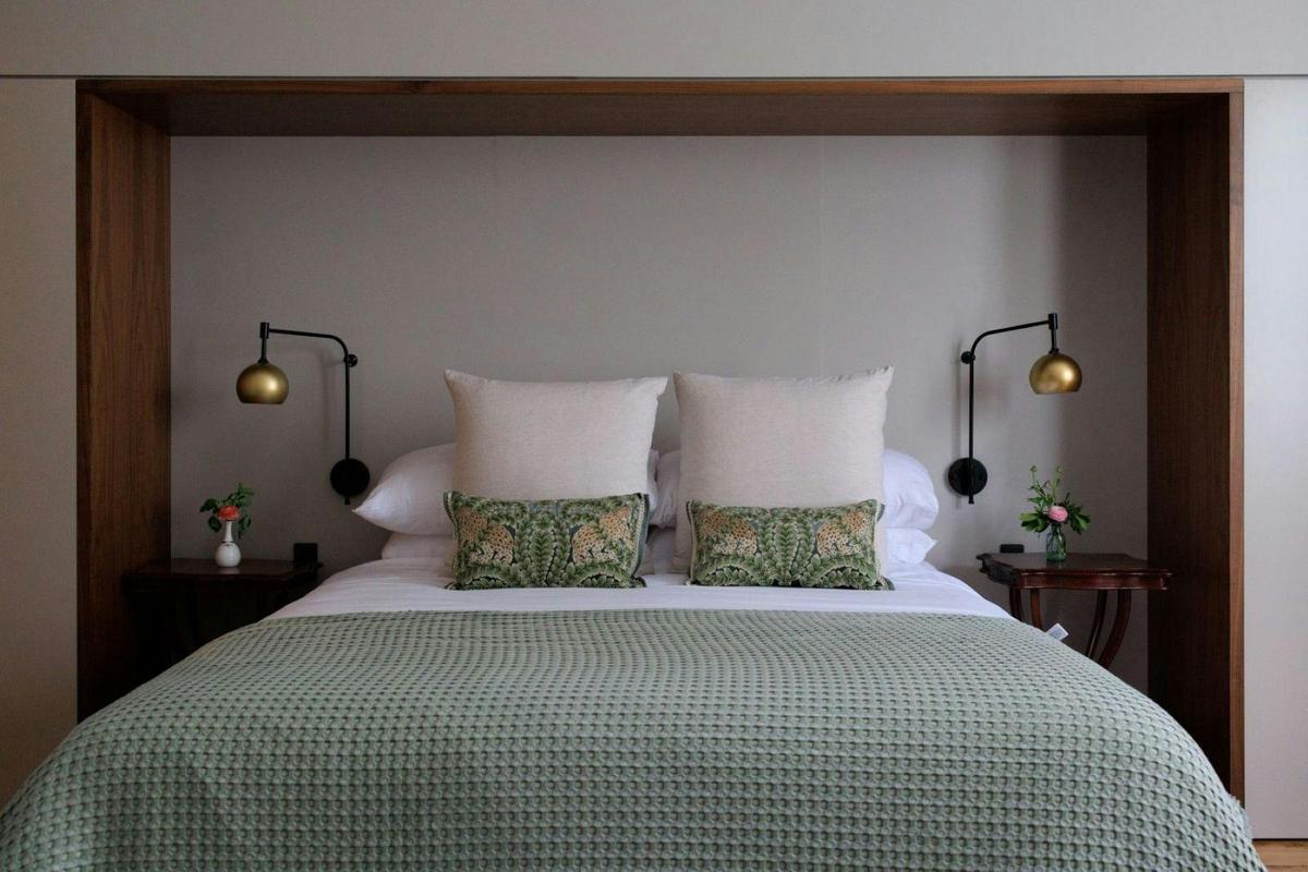 King bed in a suite with soaring ceilings and incredible space