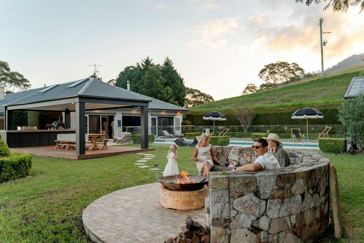 Moondance -Step outdoors to find a gazebo with BBQ and pizza oven, ideal for alfresco dining.