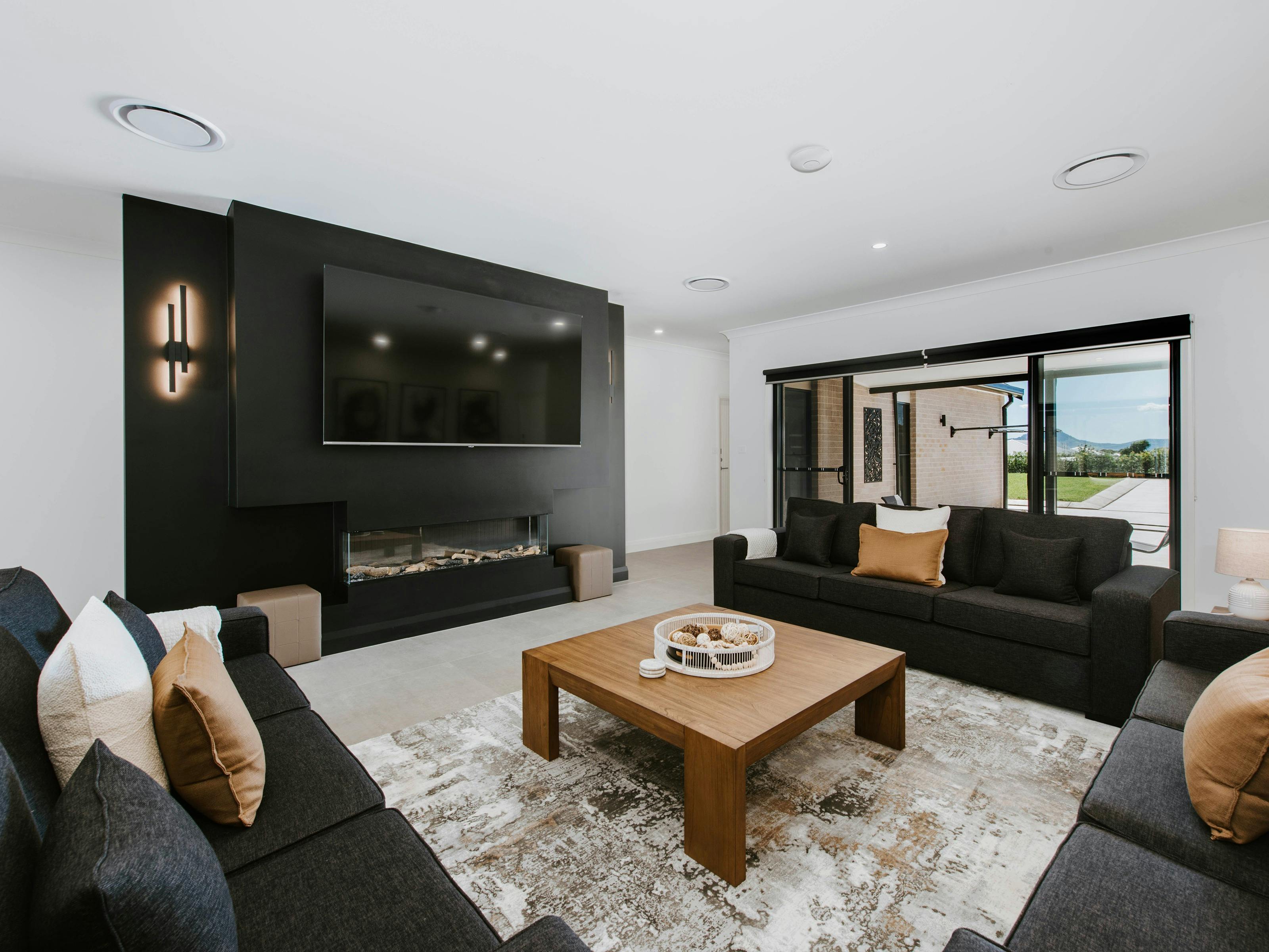 Communal lounge room with 85" TV for 12 guests