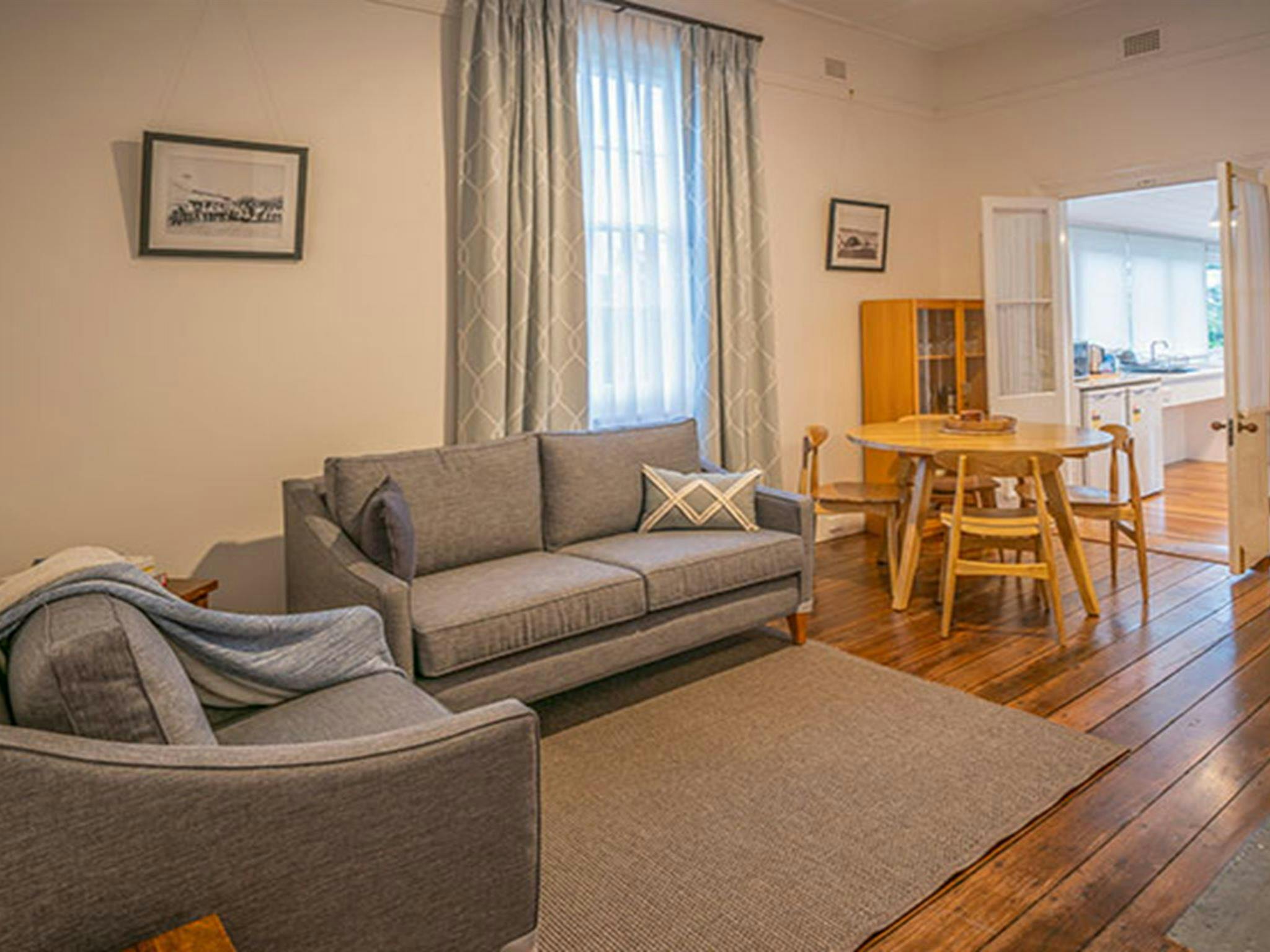 The lounge and dining room in Middle Head Officers Quarters, Sydney Harbour National Park. Photo: