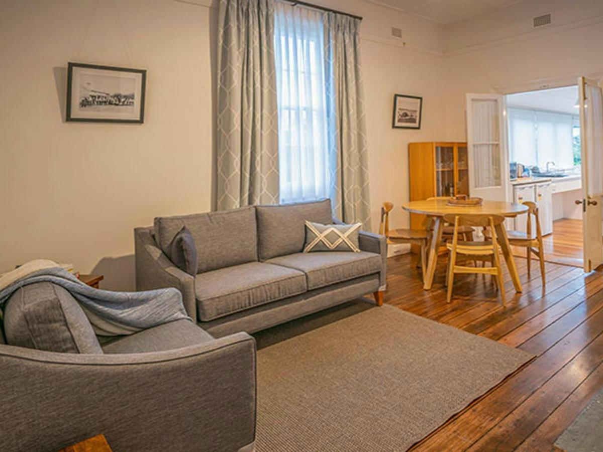 The lounge and dining room in Middle Head Officers Quarters, Sydney Harbour National Park. Photo: