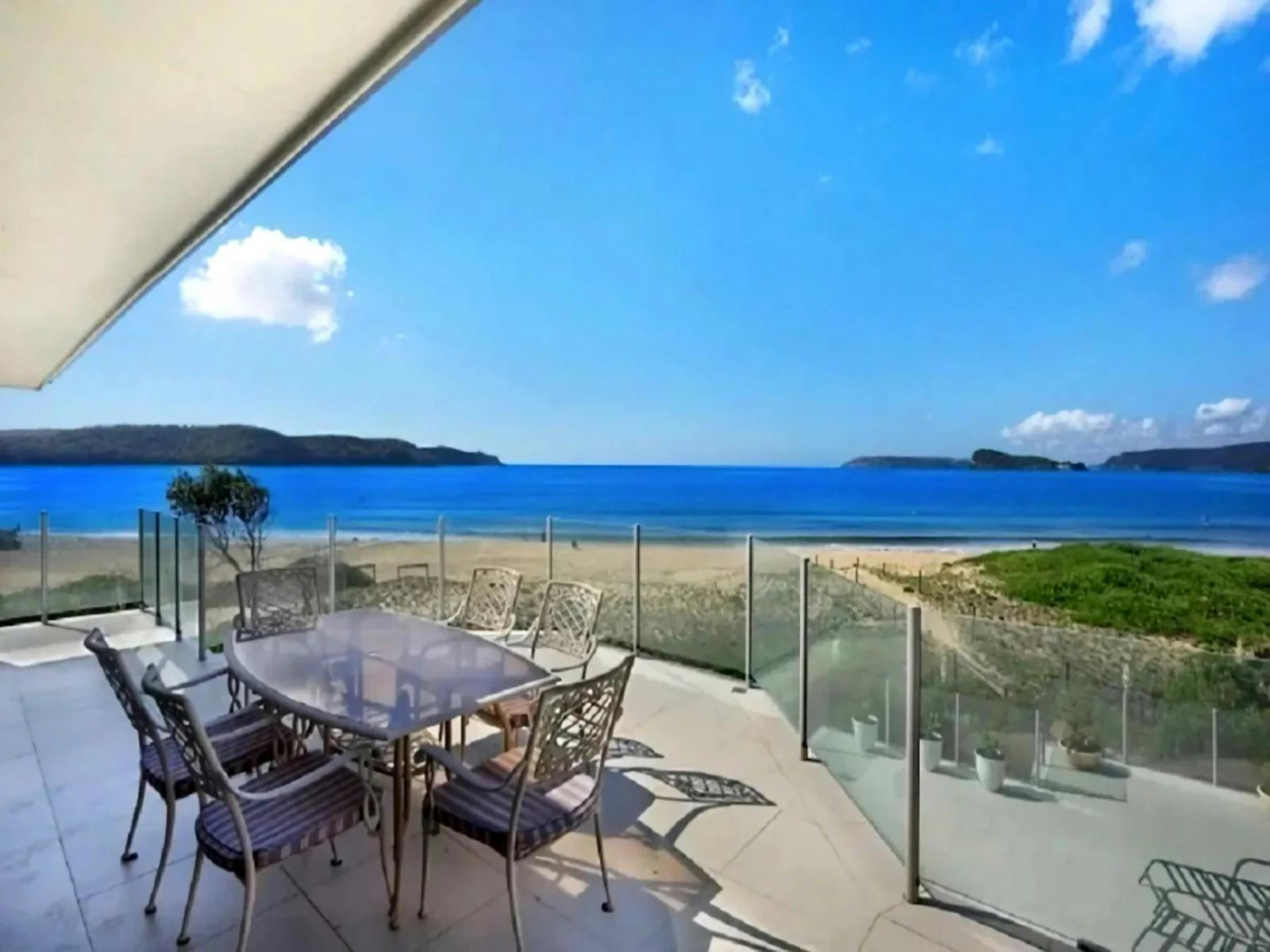 Gas BBQ and outdoor dining area offering picturesque ocean views