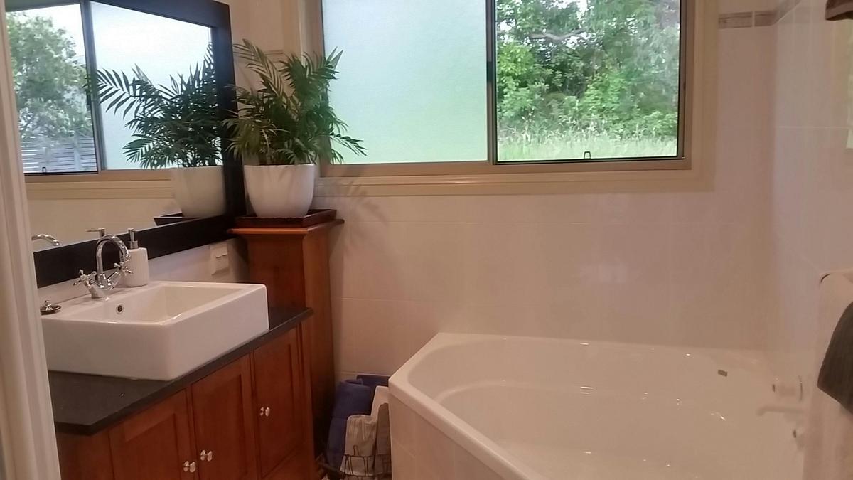 main bathroom with two person tub and shower