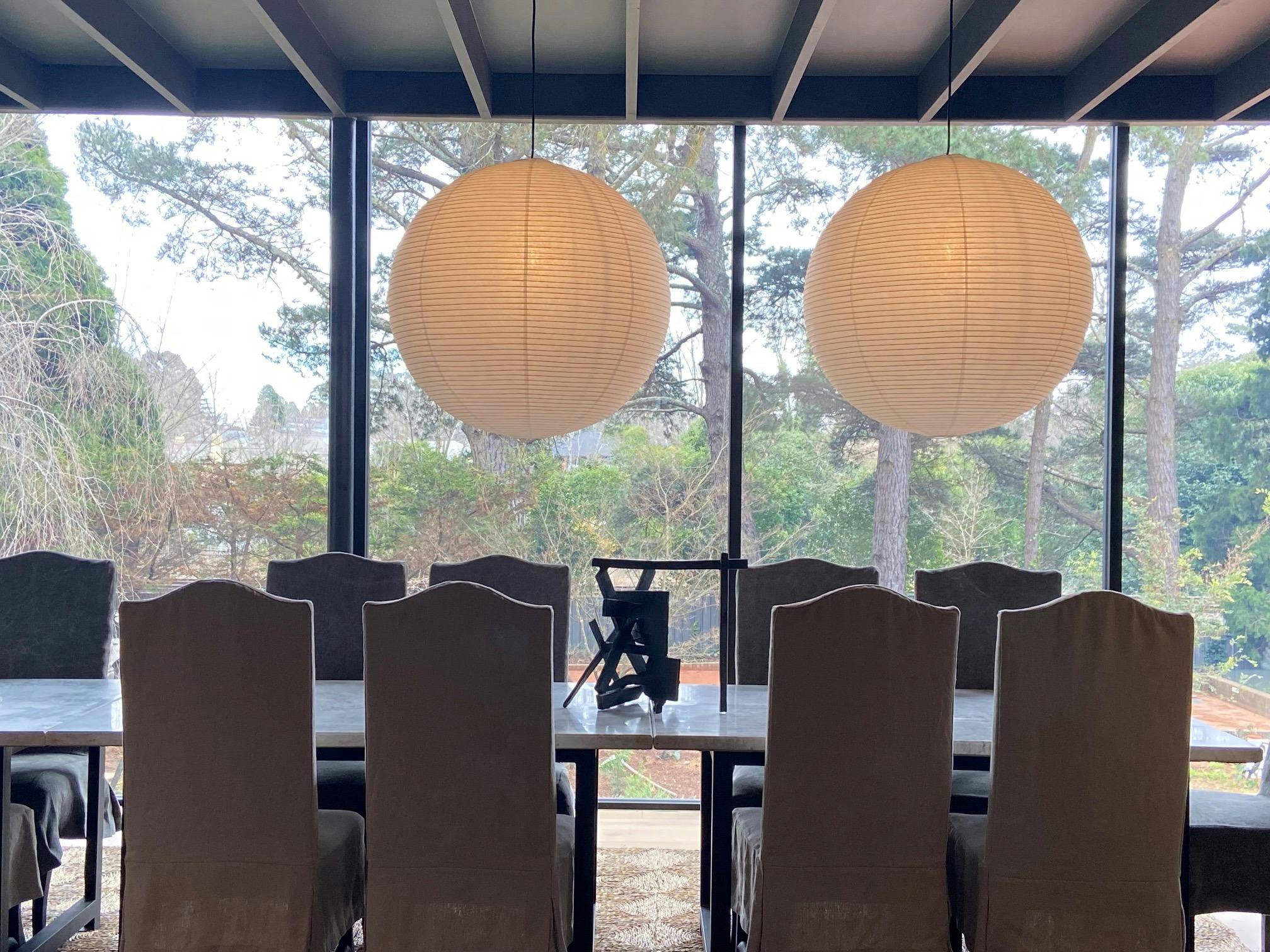 Stunning dining room in a modern glass pavilion.