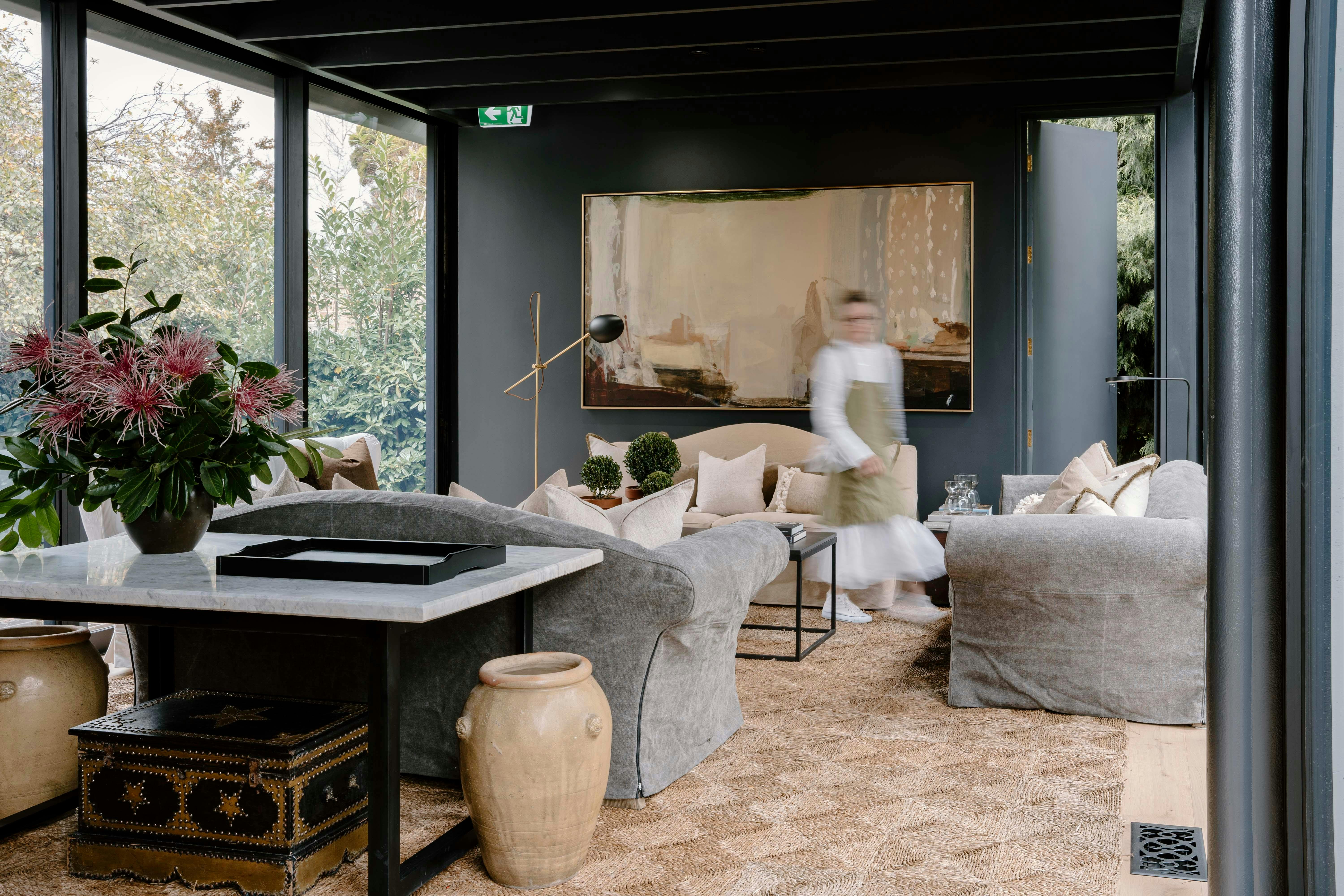 Relax amongst the trees in a beautiful sitting room enclosed in a modern glass pavilion.