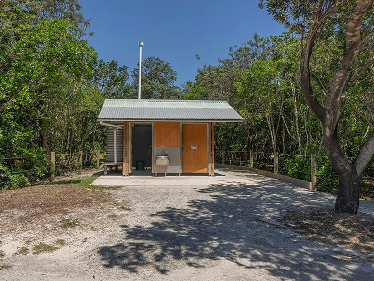 A dual-stall accessible non-flush toilet block at Mibanbah-Black Rocks campground. Credit: John