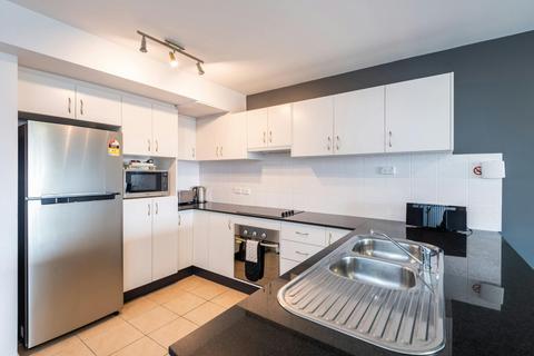 Full kitchen with dishwasher, oven, stove, microwave and fridge