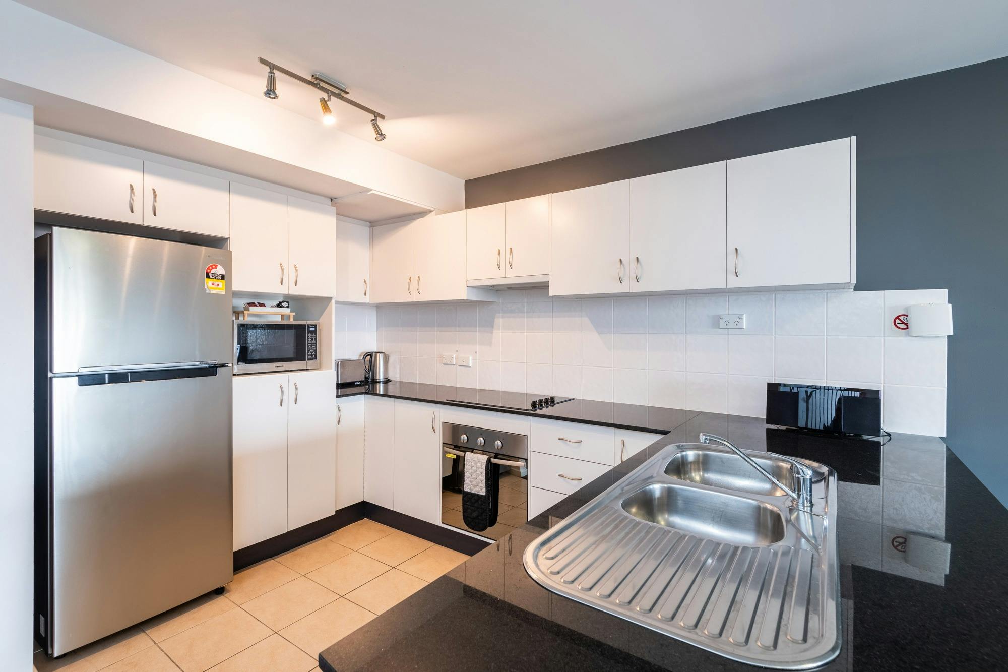 Full open plan kitchen with stove, oven, dishwasher, microwave, fridge etc