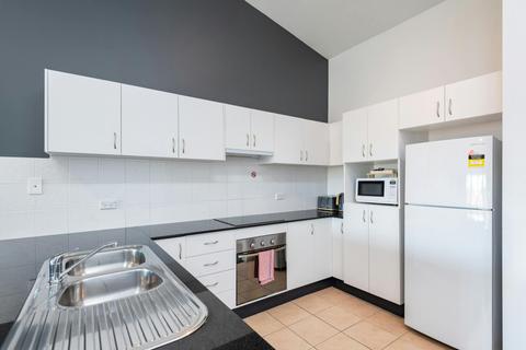 Full kitchen including stove, oven, dishwasher, microwave, and fridge