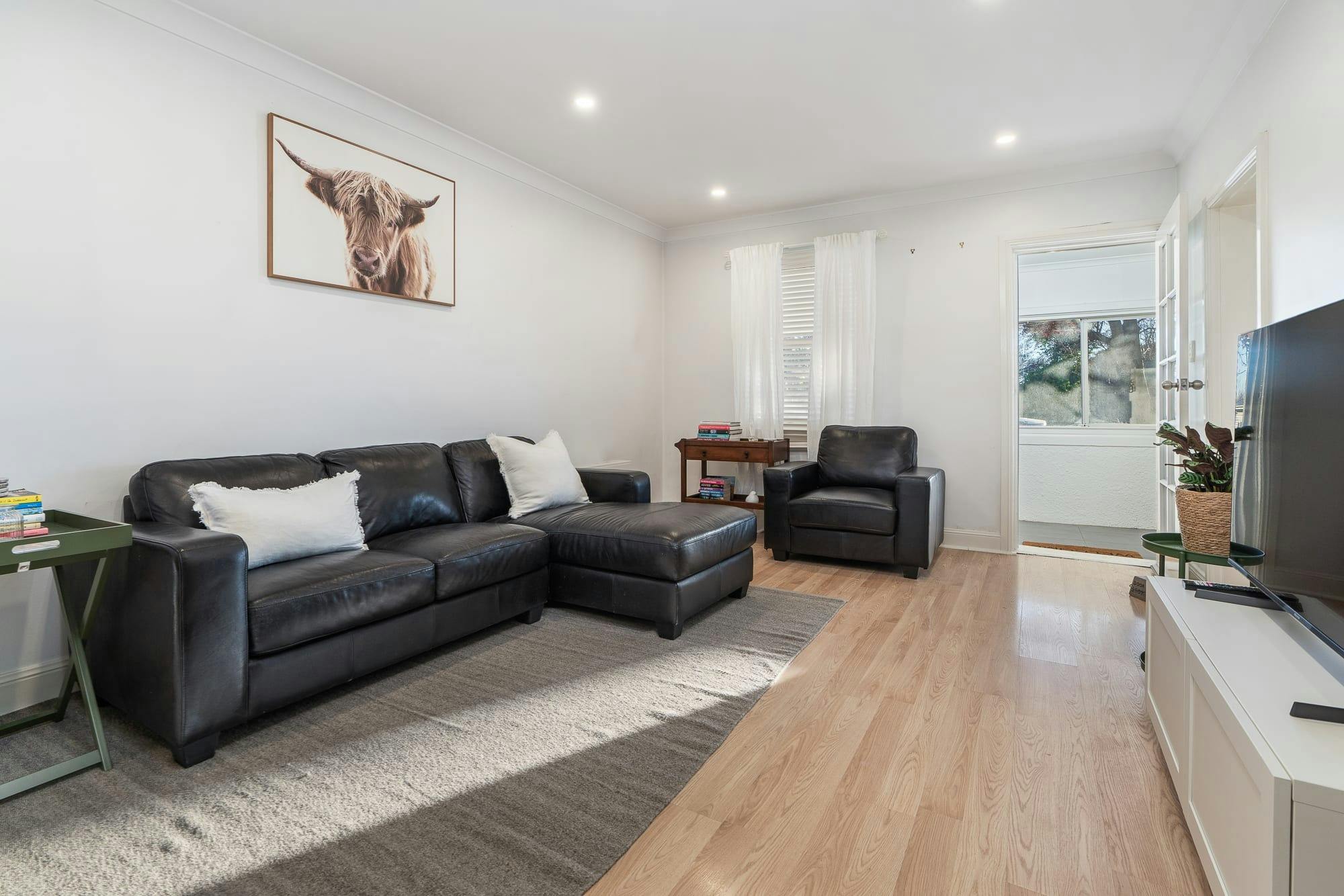 Lounge room with large sofa and armchair