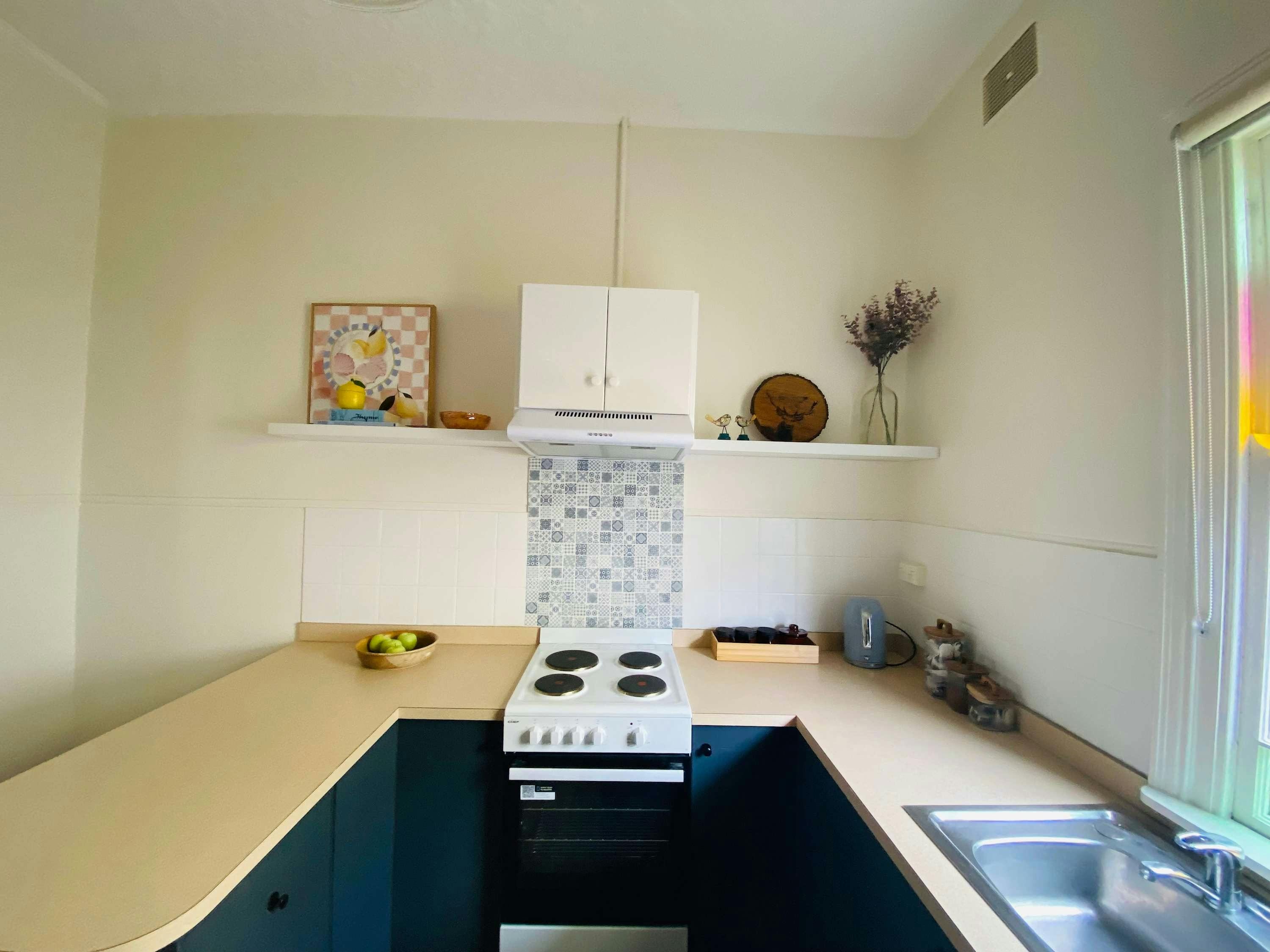 Kitchen with benches, stove and oven combo at rankin