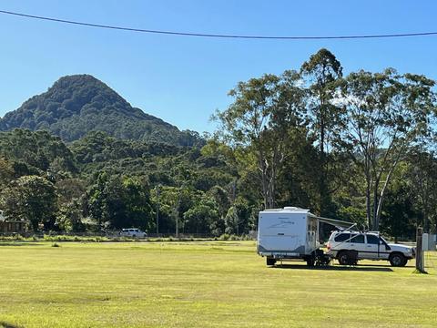 Camper settling in under the gaze of Mt Chincogan
