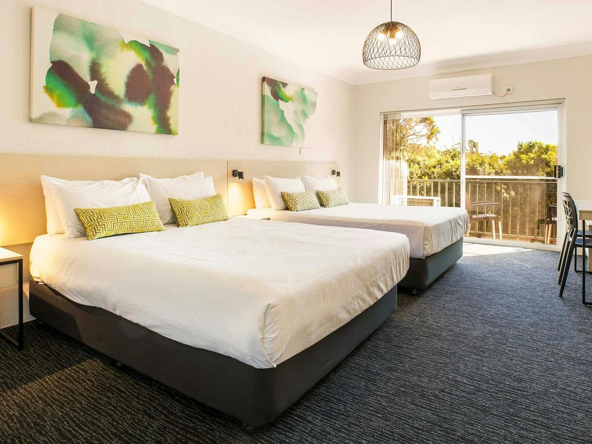 Two beds in motel room