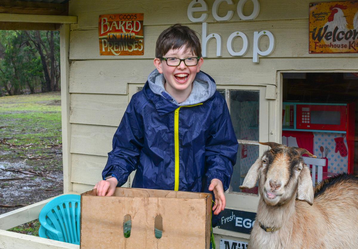 Benjamin enjoying the cubby houses with Molly our friendly goat