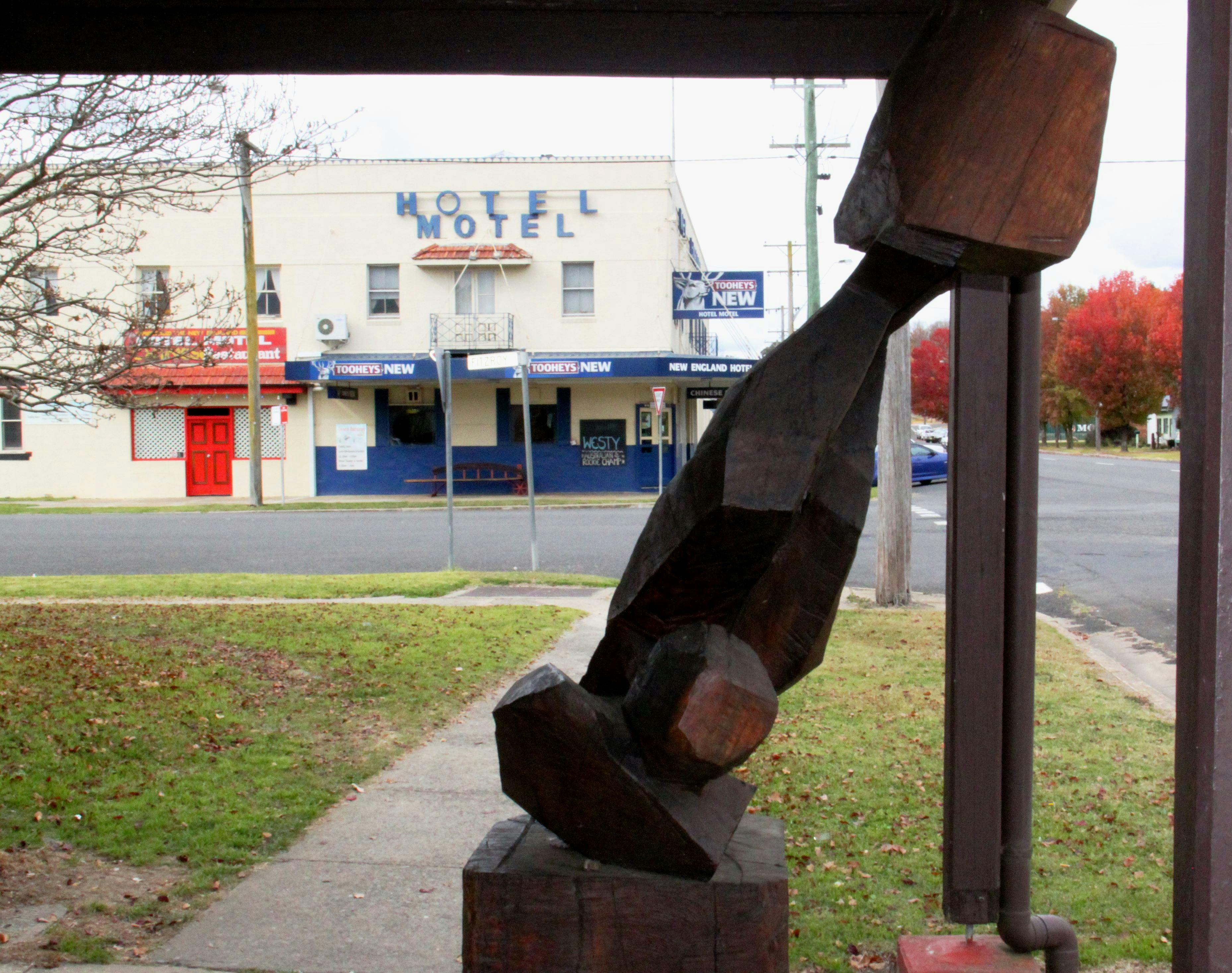New England Hotel Motel with one of the Sculptures from the Open Air Gallery