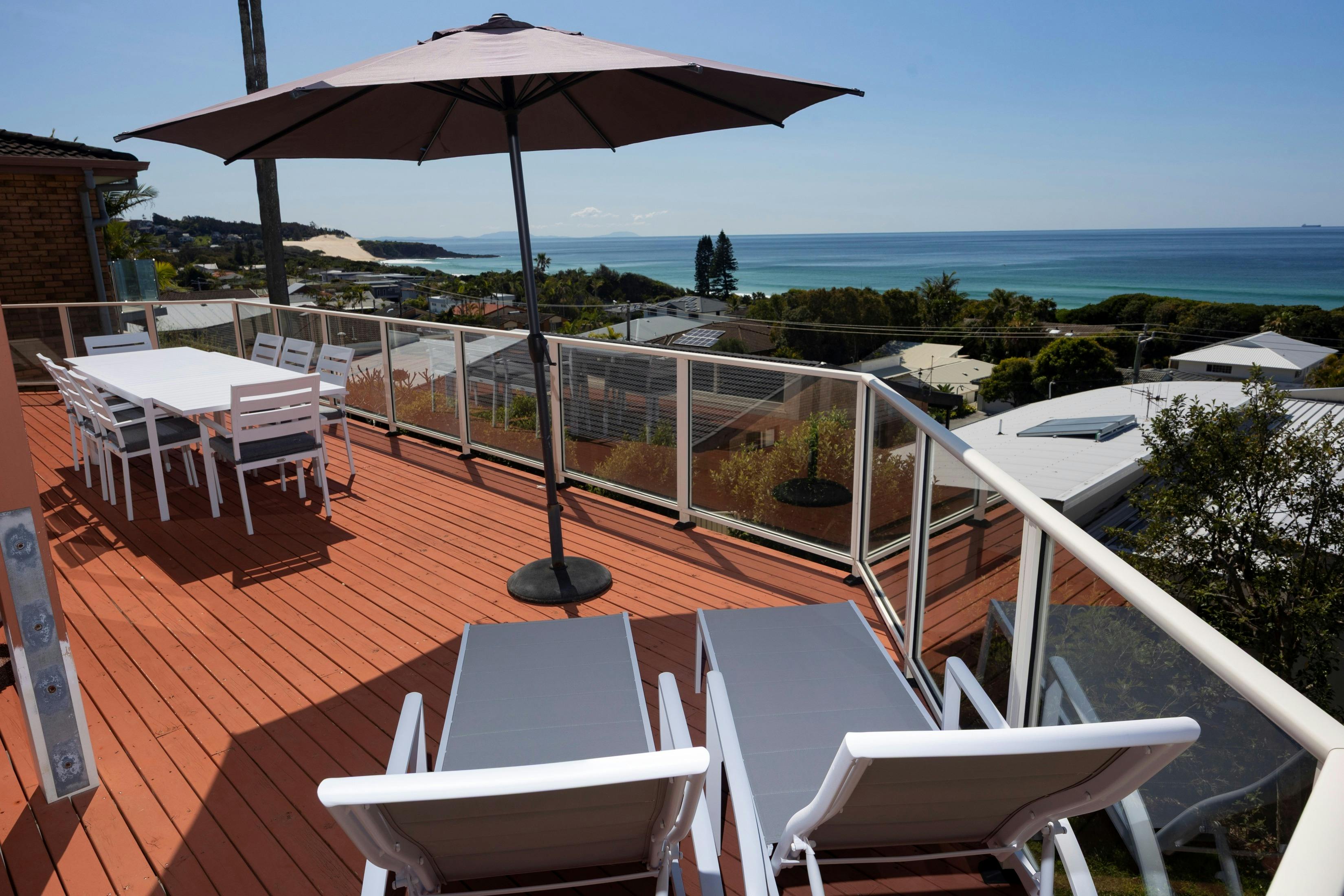 Deck with dining setting and loungers