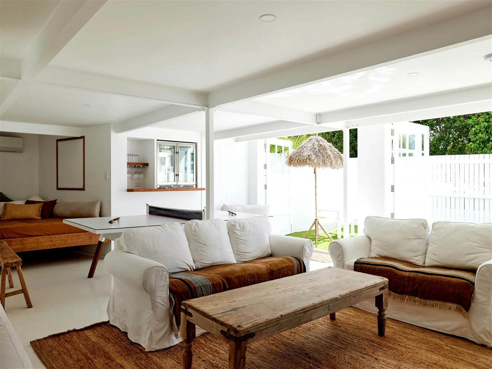 Spend for evenings in the games room with a bar fridge, designer ping pong table, lounges and a TV