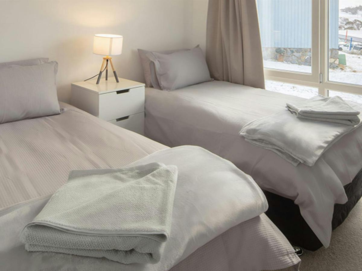 Twin beds in room at Numbananga Lodge, Kosciuszko National Park. Photo: Murray Vanderveer/OEH
