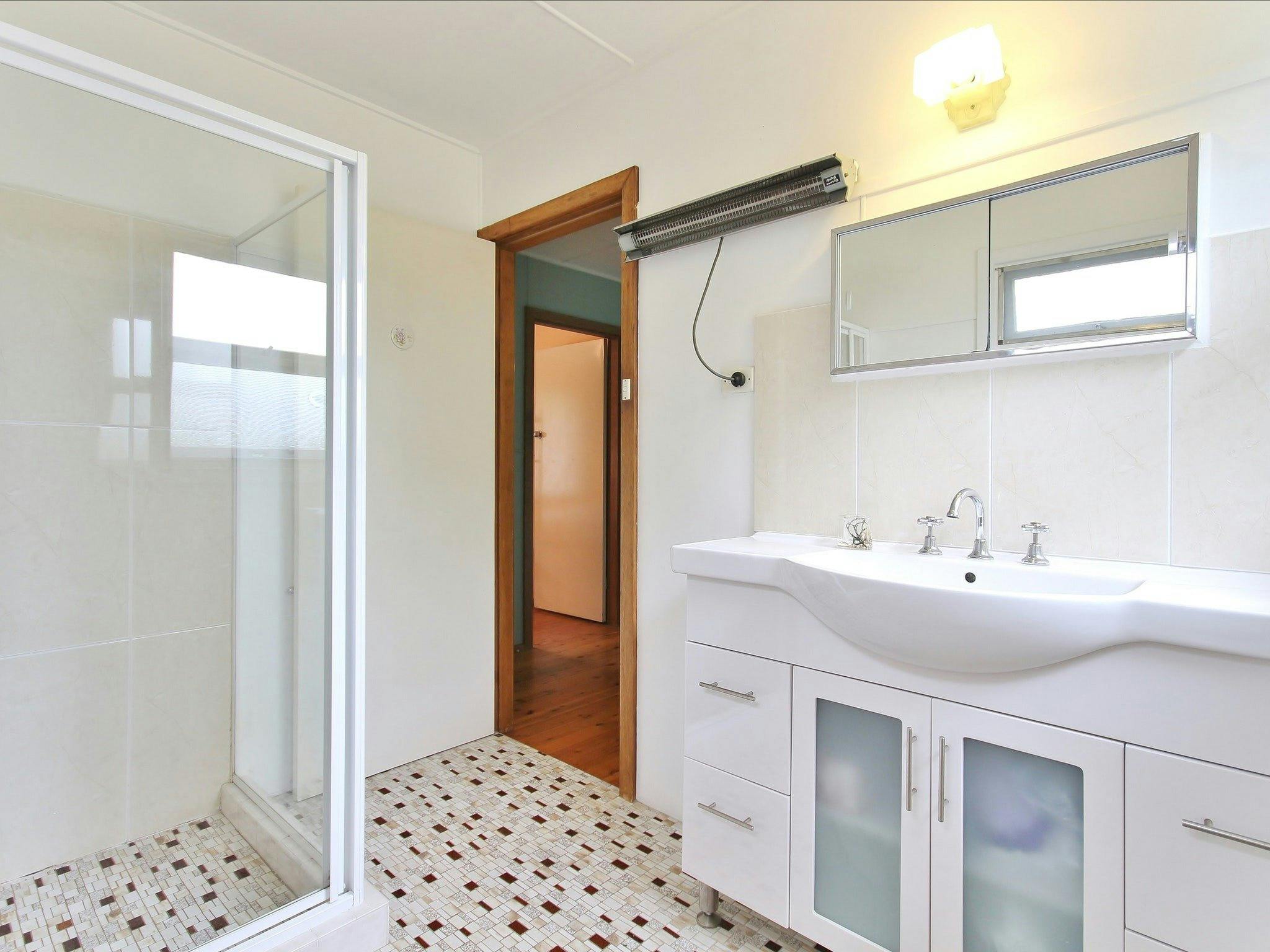 Upstairs bathroom. There is a new en-suite/laundry downstairs which adjoins the 3rd and 4th bedrooms