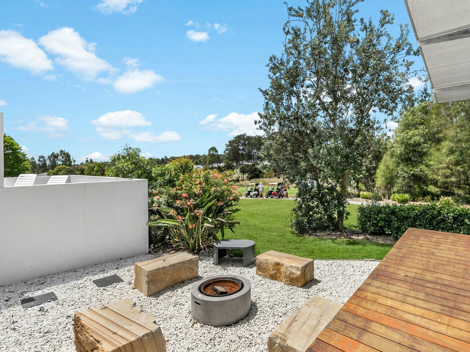 Olive Lakes outdoor entertainment area with fireplace