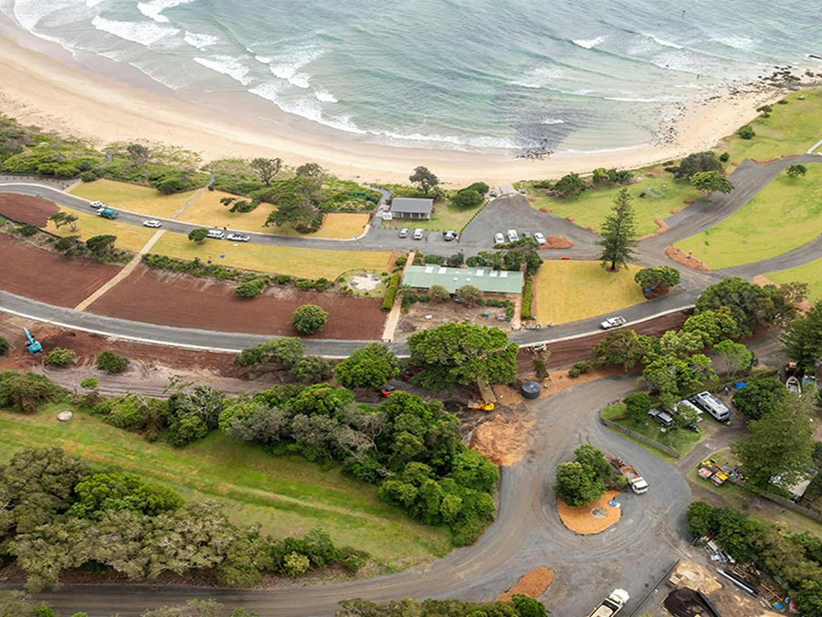 Aerial view of the campsites, the beach and the access road at Point Plomer campground. Credit: John