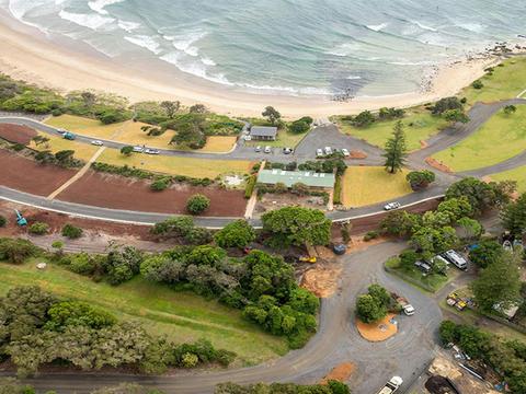 Aerial view of the campsites, the beach and the access road at Point Plomer campground. Credit: John